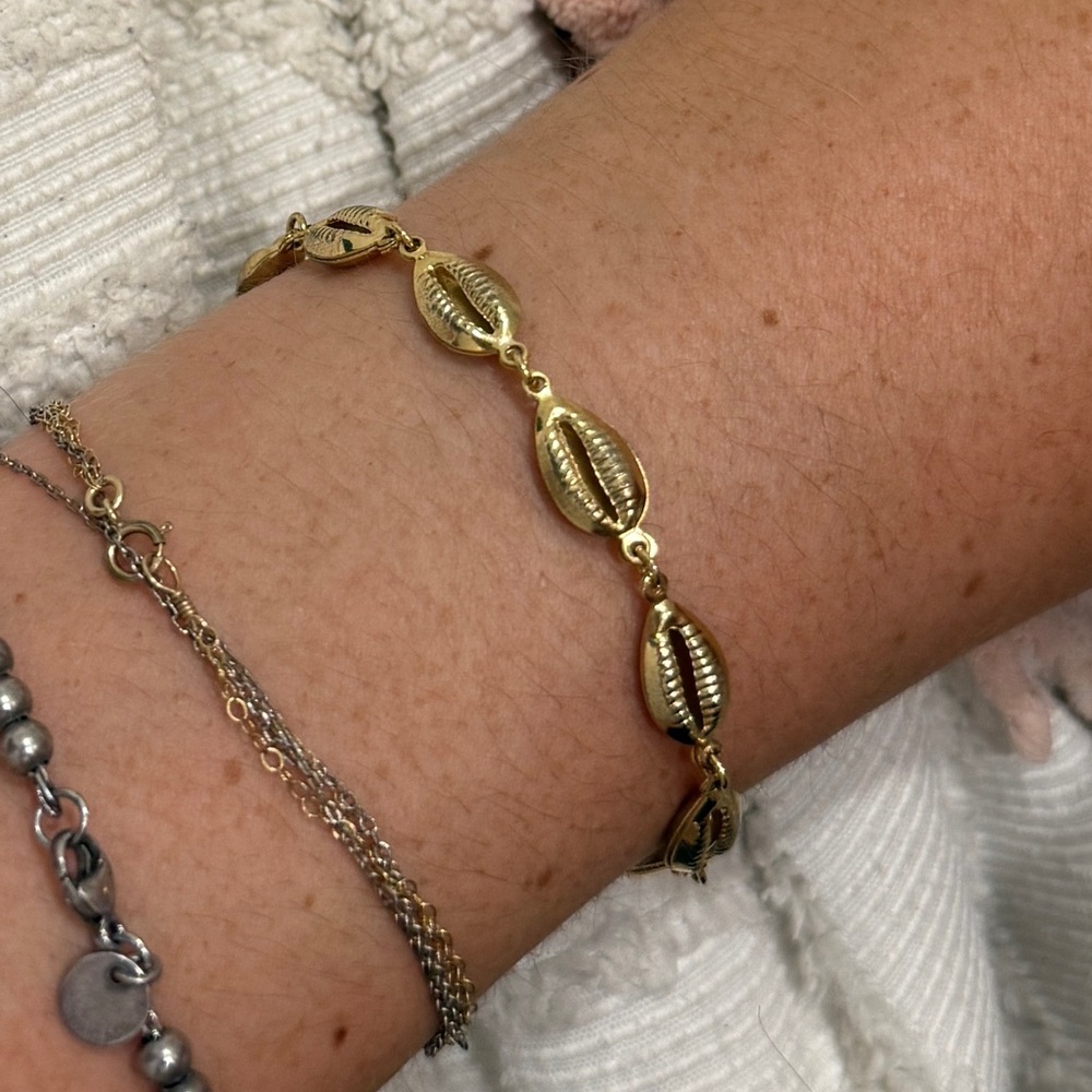 Gold cowry shell bracelet
